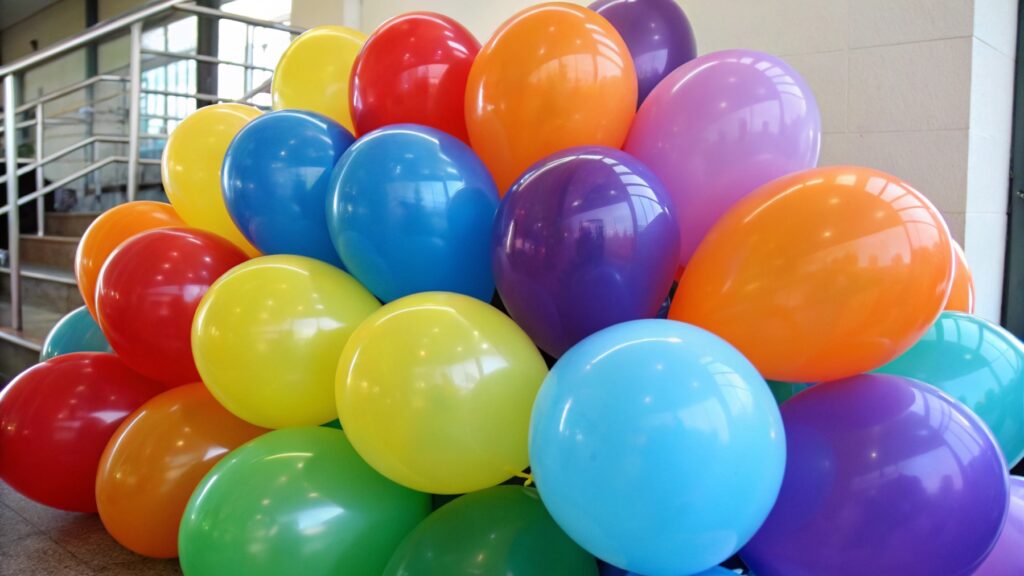A pile of colorful latex balloons