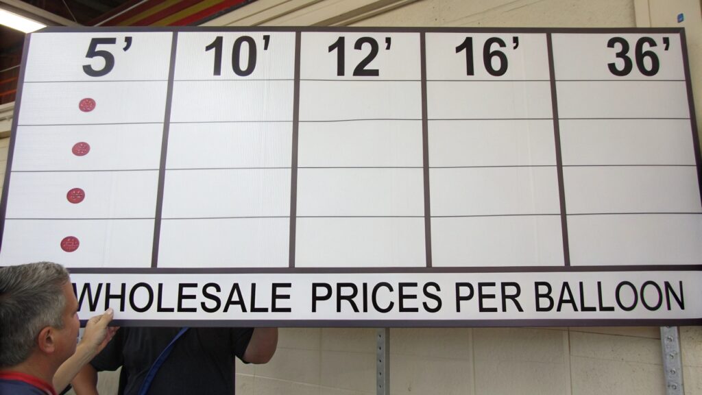 A price list showing different balloon sizes and their wholesale prices