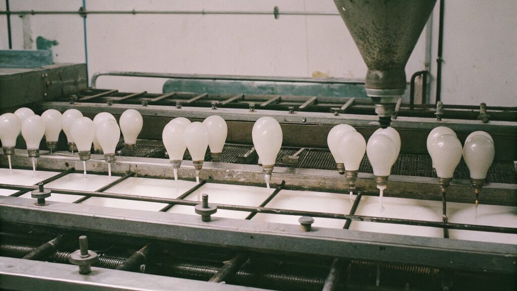 A factory floor with machines making different sized balloons