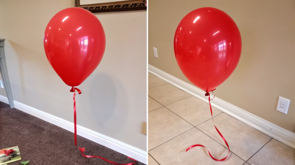 A floating helium-filled balloon next to an air-filled balloon on the floor