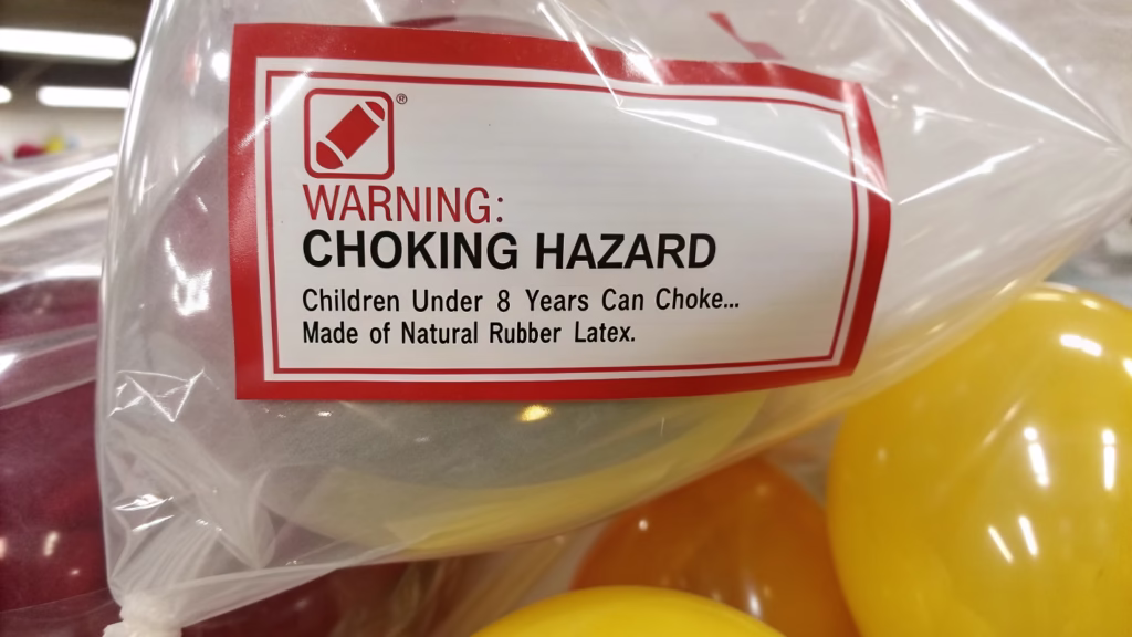 A close-up of a balloon package showing a clear allergy warning label
