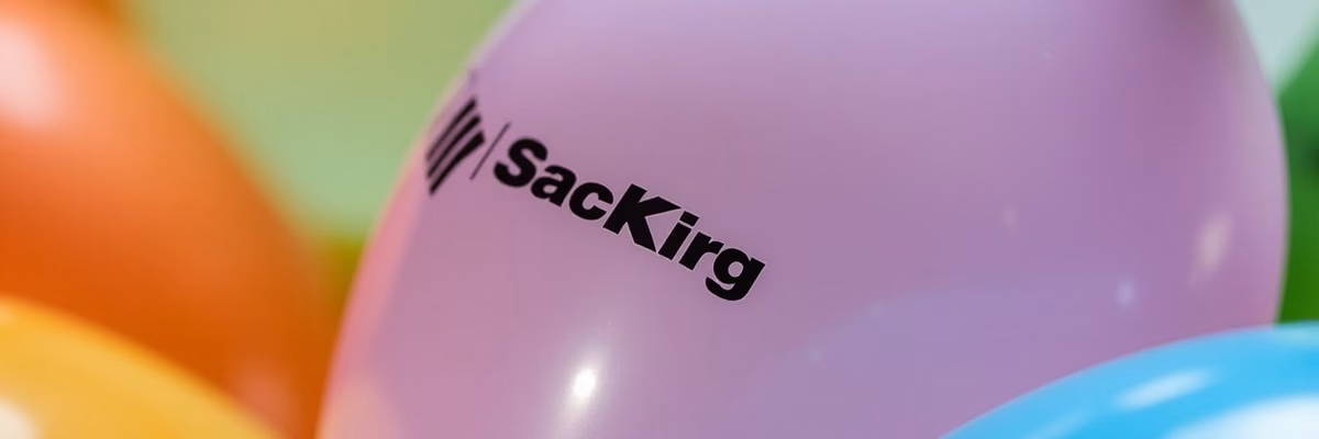 Close up of a custom printed latex balloon showing a clear company logo